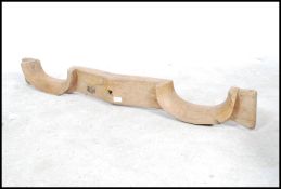 A 19th century country farming - agricultural yoke  of shaped form with remains of cast iron