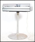 A 1970's Studio 2000 Grundig Hi-FI having silvered body with acrylic hood and raised on stunning
