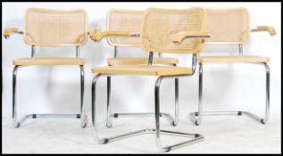 After Marcel Breuer, a set of four dining chairs. The chairs comprising of a chromed tubular