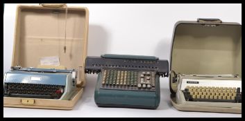 2 vintage mid century retro typewriters, one by Adler, the other by Underwood together with an early