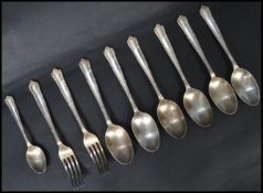 A set of six silver dessert spoons ( tested ) together with two matching forks. All marked silver.