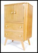 A vintage retro mid 20th century tall boy, fitted with two long doors opening to reveal a fully