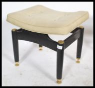 An original 1950's G-Plan Ernest Gomme dressing table stool raised on ebonised legs with