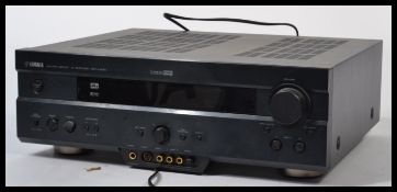 A Yamaha DSP AX620 Black NOir AV Amplifier complete in the original packaging.