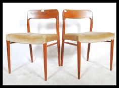 A pair of mid century Niels Moller teak wood dining chairs model no 75. Each with stunning shaped