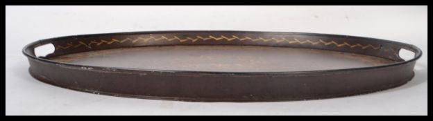 An early 20th century Regency revival 18th century style mahogany butlers serving toleware tray