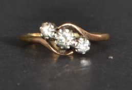 A 14ct gold and platinum diamond crossover ring. Weighs 2.8 grams Size R.