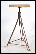 A vintage Industrial 20th century factory  / potters stool with wooden seat and hairpin metal base