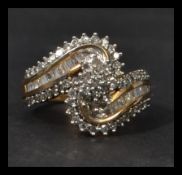 A hallmarked 9ct gold and diamond ring having bagu