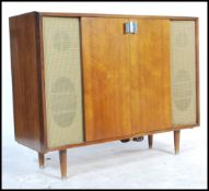 A mid 20th century teak wood record player cabinet / stereogram by Murphy having a good facia with