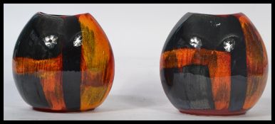 Poole Pottery - A pair of matching Studio Poole Pottery vases in the ' Delphis ' pattern stamped
