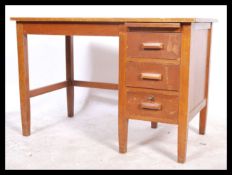 A vintage 20th century Air Ministry / Industrial style single pedestal knee-hole oak writing desk. A