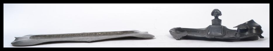 A stunning Art Nouveau pewter inkwell / desk tidy together with am Arts and Crafts hand beaten