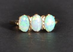 A 9ct gold opal three stone ring. SIze k Weighs 1.9 grams.