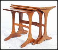 A retro 20th century nest of three E Gomme for G-Plan teak tables, the rectangular tops on