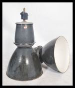 A pair of large vintage industrial 20th century factory black enamel ceiling lights. Each  retaining