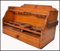 A stunning mid 20th century wooden fully appointed test tube stand with spaces for test tubes,