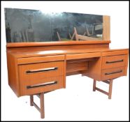 A 1970's EON - Elliotts of Newbury teak wood dressing table in the manner of Mogens Kolo. The teak