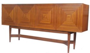 A good Danish mid century large teak wood sideboard raised on shaped legs united by stretchers