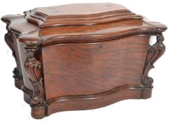 An 18th / 19th century Regency mahogany sarcophagus wine cooler  celerette. Raised on a plinth skirt