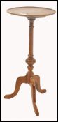 A 19th century Georgian mahogany wine table of small pedestal form. Raised on splayed tripod leg