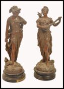A pair of Edwardian gilded spelter classical Art Nouveau figurines entitled ' Idylle & Duo ' Each of