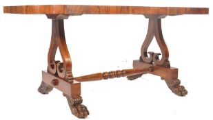 A large 19th century Regency Irish / Scottish rosewood library table desk being raisaed on pierced