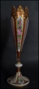 A 19th century Bohemian cranberry and white cased glass vase of baluster form painted with