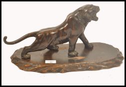 A  good Japanese bronze model of a Tiger dating to the Meiji Period. The scuplture being modelled