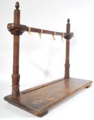A 19th century Georgian elm wood book / bible stitching / sewing book binding tool frame being