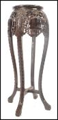 A 19th century Chinese carved hardwood plant stand - jardiniere. Of upright form  with circular
