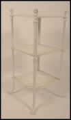 A 19th century cast and wrought iron three tier garden plant stand torchere / jardiniere in the