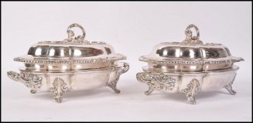 A pair of 19th century Victorian silver plated tureens raised on scrolled acanthus feet with foliage