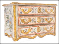A 19th century Faience handpainted serpentine fronted commode chest of drawers jewellery box