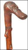 A 19th century blackthorn carved walking stick, the tapering shaft culminating in the head of