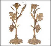 A pair of 19th century French gilt brass ormolu candlesticks raised on a six shell bases with
