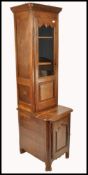 A 19th century French pedestal country oak library bookcase cabinet. The base with single locker