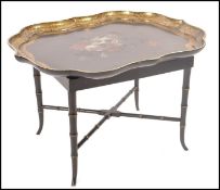 A 19th century Victorian papier mache tray by B Walton and Co having scalloped edges with hand