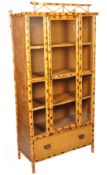 A Victorian Aesthetic movement bamboo upright tall display cabinet. Bamboo supports with stunning