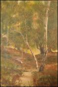 A 19th century oil on canvas painting of a forest and stream with bridge. The painting signed and