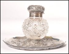 A 19th century Victorian silver hallmarked large inkwell and stand of rococo influence. Hallmarked
