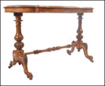 A 19th century High Victorian walnut and seaweed inlaid ladies writing table desk. Raised on