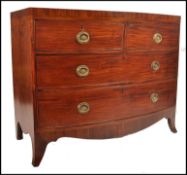 A 19th century mahogany bow front  bachelors chest of drawers being raised on French ' kick legs '