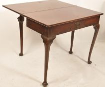 An 18th century Georgian solid mahogany fold over tea / games card table having a serpentine edge