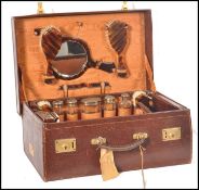 A good gentlemans early 20th century fitted crocodile skin suitcase being fully appointed within