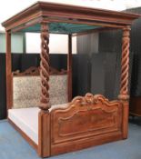 A Victorian 19th century mahogany 4 poster bed of large proportions with double helix twist bed