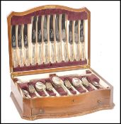 A part silver hallmarked six person Viners canteen of cutlery consisting of four table basting