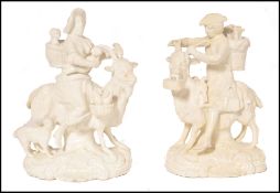 A pair of 19th century Derby, Samuel & Heathcote porcelain figures of the tailor and his wife.