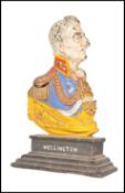 A Victorian cast iron door stop in the form of the Duke of Wellington. Set over an ebonised