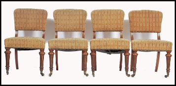 A good set of 4 Victorian boardroom dining chairs having  mahogany frames with turned reeded legs,